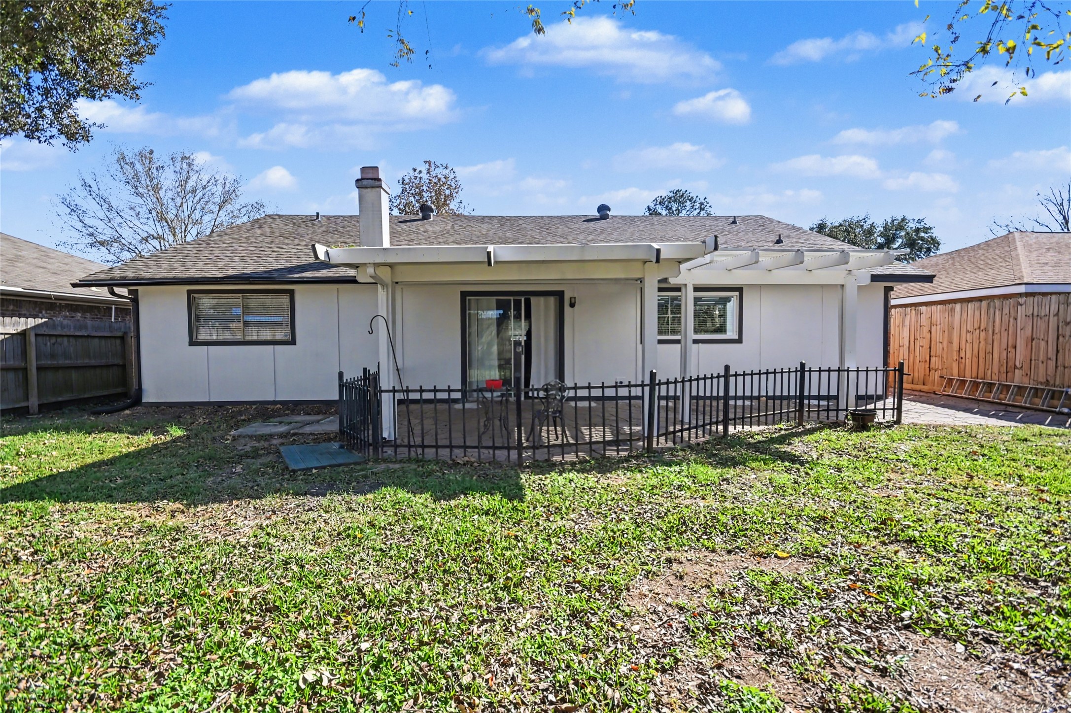 4202 Townes Forest Road Friendswood, TX 77546 - Photo 16 of 17 a view of a house with a yard and plants