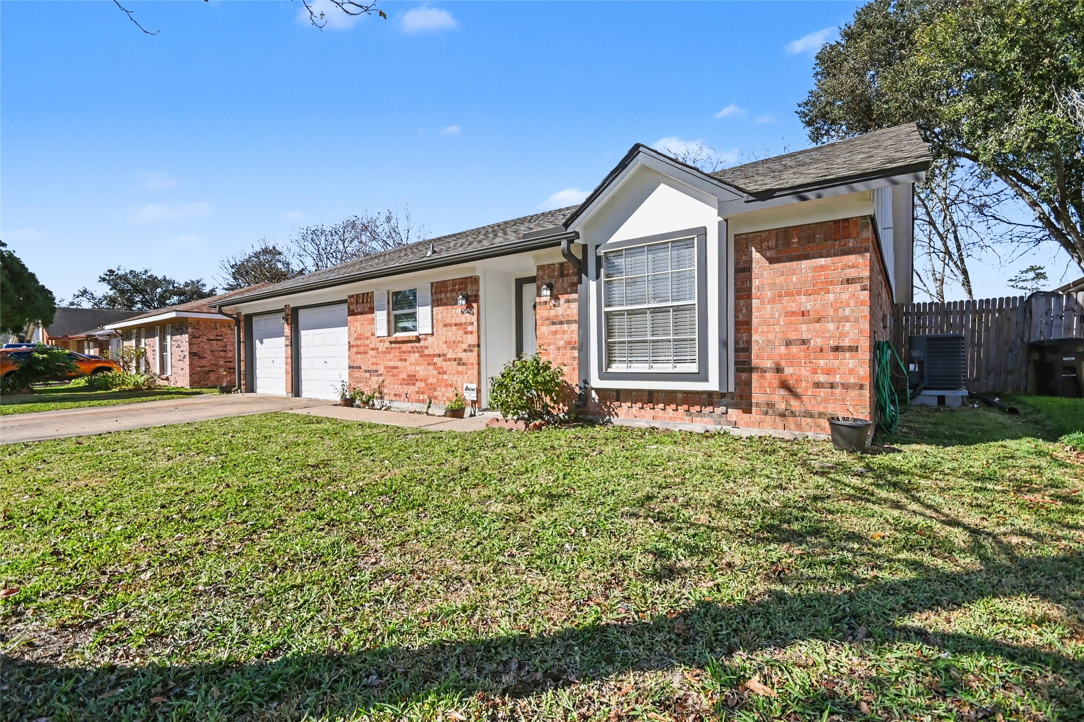 4202 Townes Forest Road Friendswood, TX 77546 - Photo 2 of 17 a front view of a house with garden