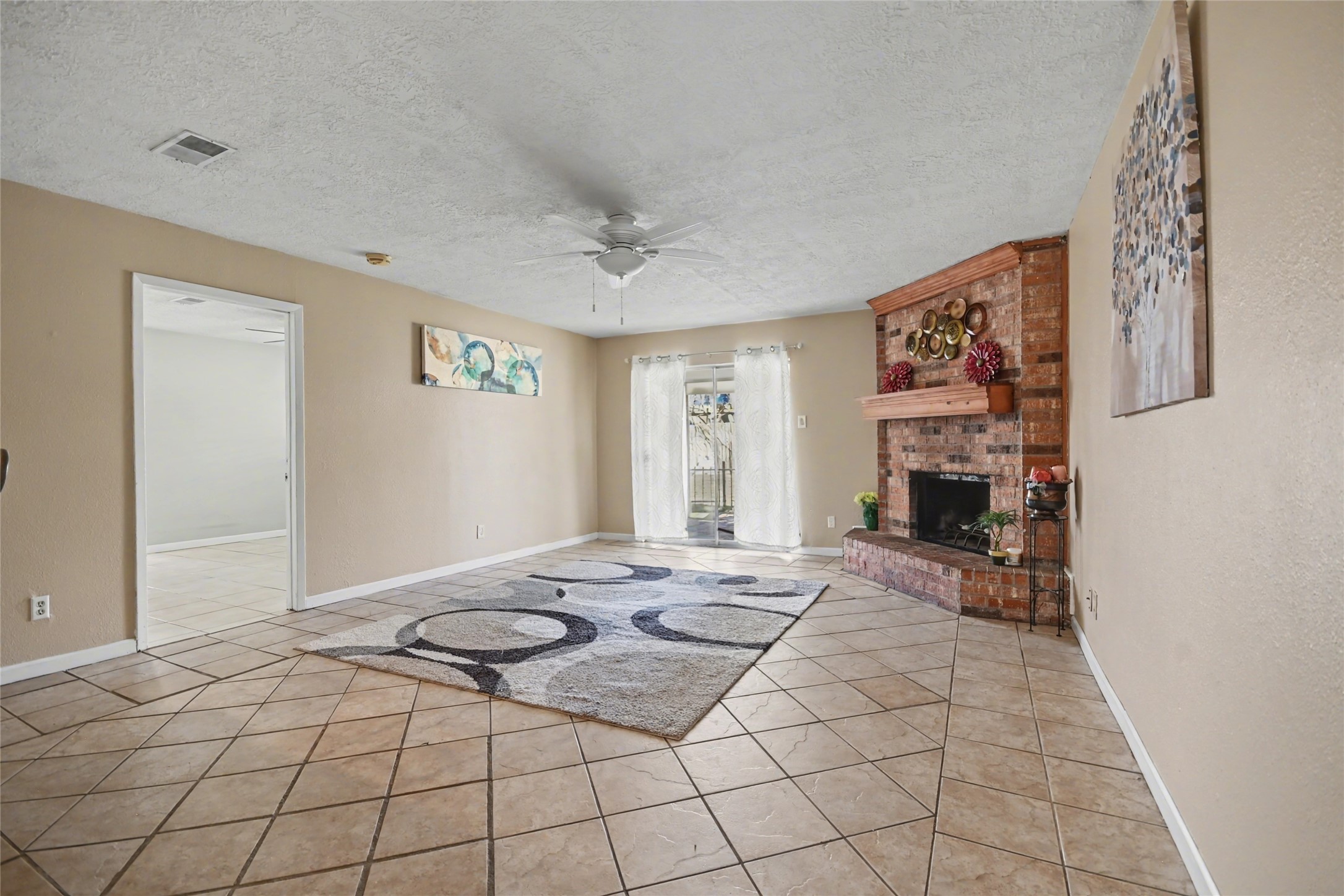4202 Townes Forest Road Friendswood, TX 77546 - Photo 9 of 17 a bedroom with a bed and a fireplace