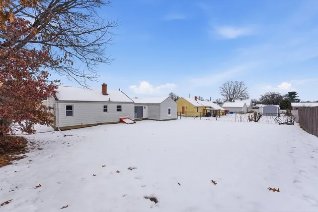 a view of a house with a snow in the background