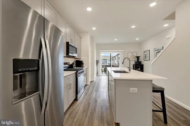 a picture of a bench in front of a wall