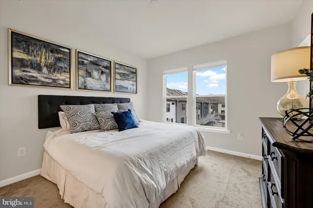 a bedroom with a bed and a mirror