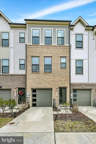 a view of a house with a yard and plants