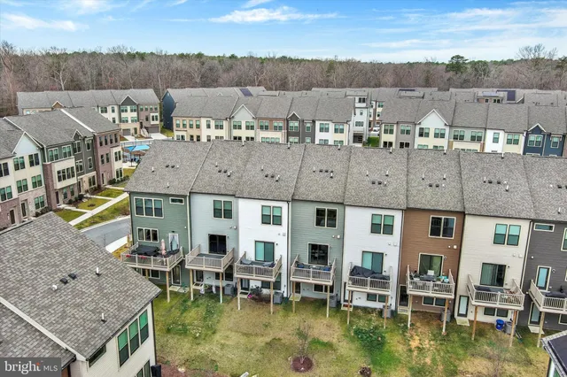 a swimming pool with a yard in the back