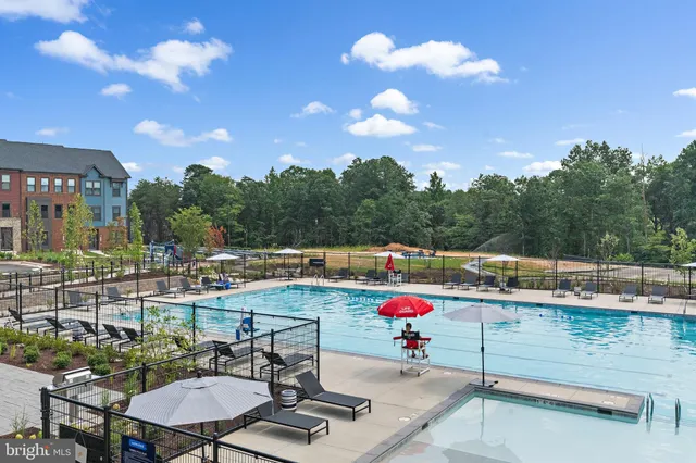 a view of a field with trees in the background