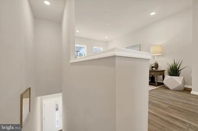a living room with furniture a flat screen tv and a table
