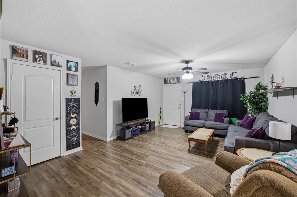 123 Harmon Road Gun Barrel City, TX 75156 - Photo 11 of 36 a living room with furniture and a flat screen tv