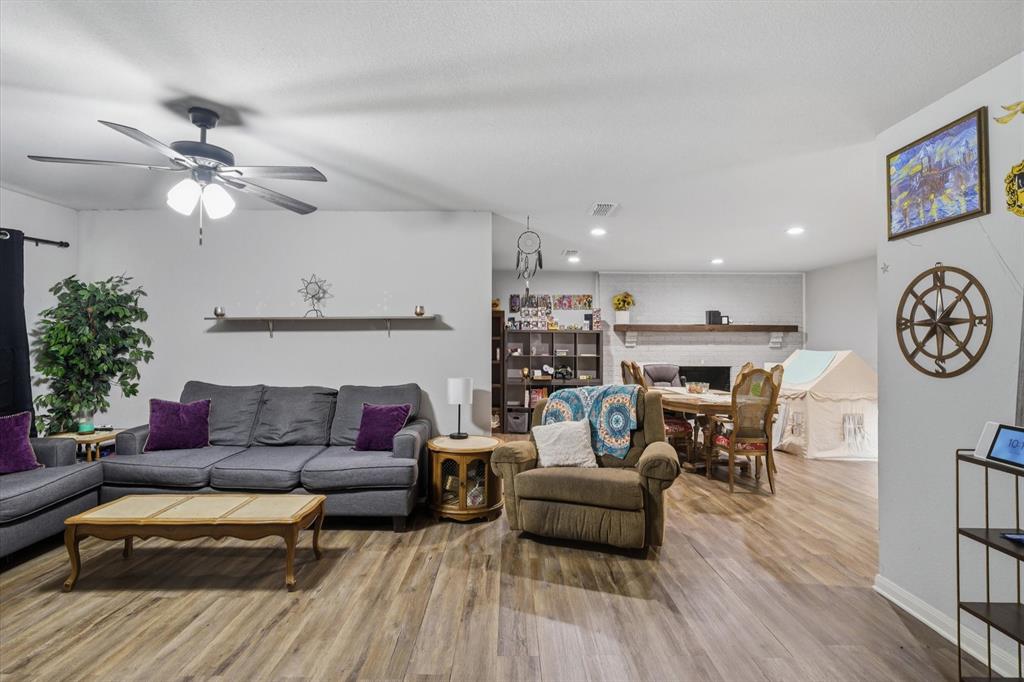123 Harmon Road Gun Barrel City, TX 75156 - Photo 13 of 36 a living room with furniture kitchen view and a wooden floor