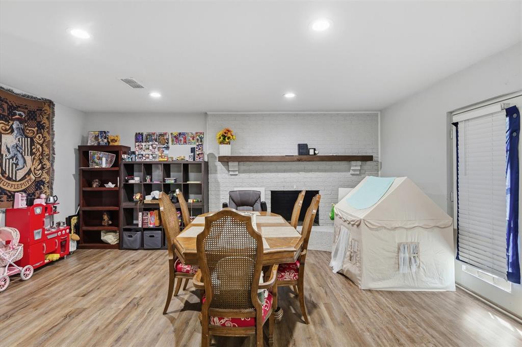 123 Harmon Road Gun Barrel City, TX 75156 - Photo 14 of 36 a view of a dining room with furniture and wooden floor