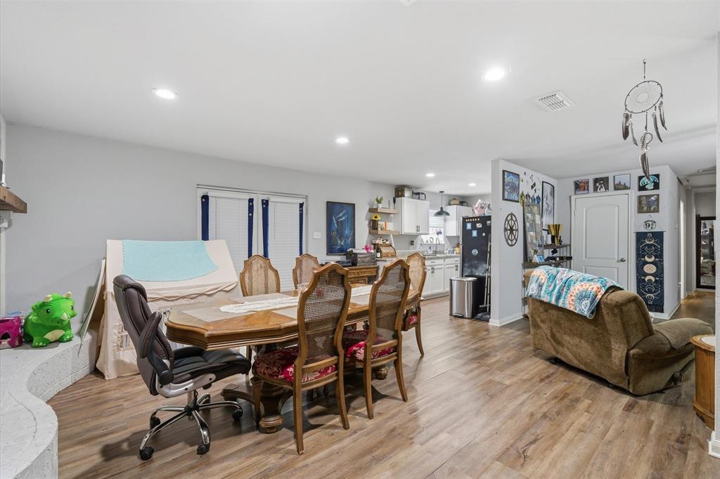 123 Harmon Road Gun Barrel City, TX 75156 - Photo 15 of 36 a view of a dining room with furniture and wooden floor