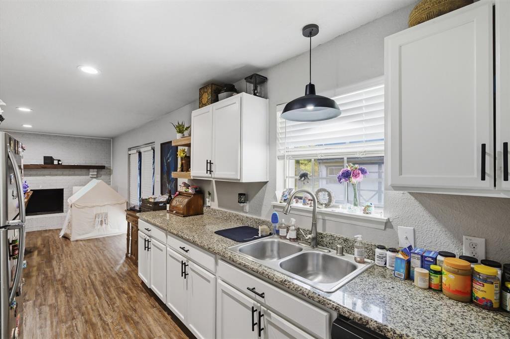 123 Harmon Road Gun Barrel City, TX 75156 - Photo 19 of 36 a kitchen with sink refrigerator and microwave