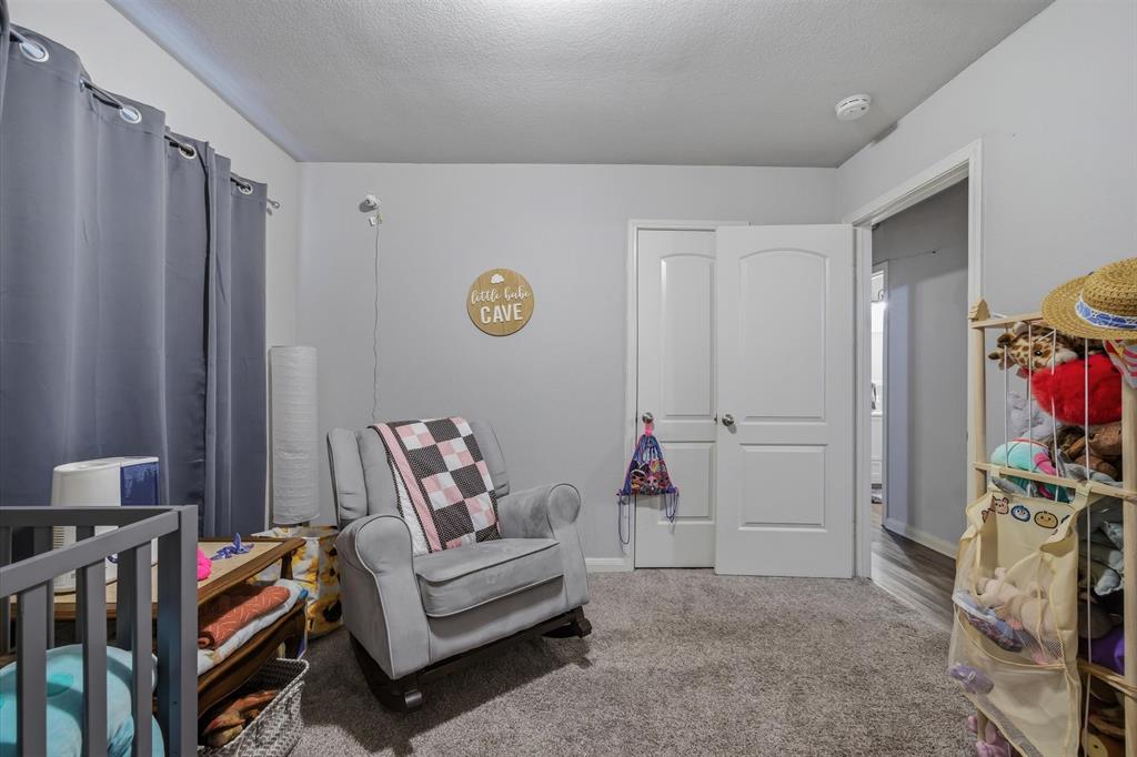 123 Harmon Road Gun Barrel City, TX 75156 - Photo 23 of 36 a living room with furniture and a flat screen tv