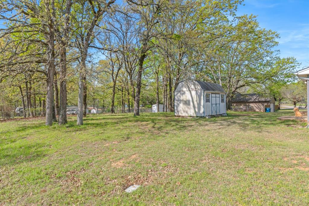 123 Harmon Road Gun Barrel City, TX 75156 - Photo 34 of 36 a backyard of house with trees