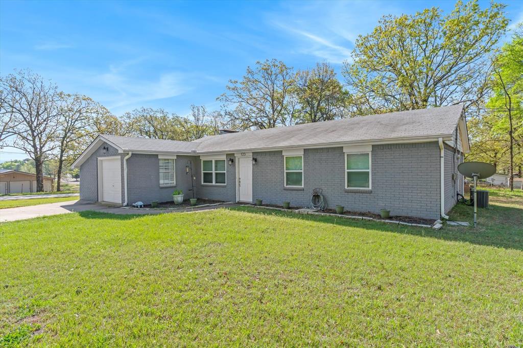 123 Harmon Road Gun Barrel City, TX 75156 - Photo 5 of 36 a backyard of a house with table and chairs