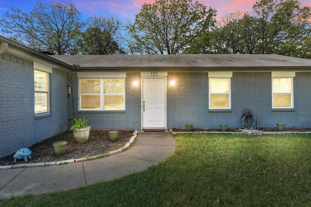 123 Harmon Road Gun Barrel City, TX 75156 - Photo 7 of 36 a house view with a garden space