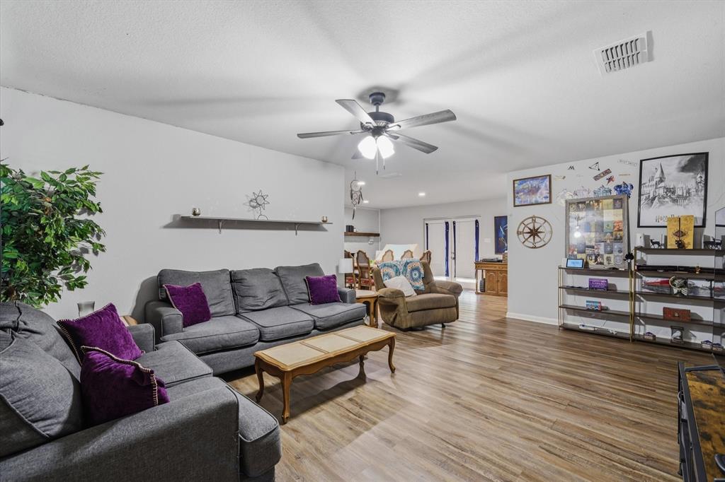 123 Harmon Road Gun Barrel City, TX 75156 - Photo 9 of 36 a living room with furniture and wooden floor