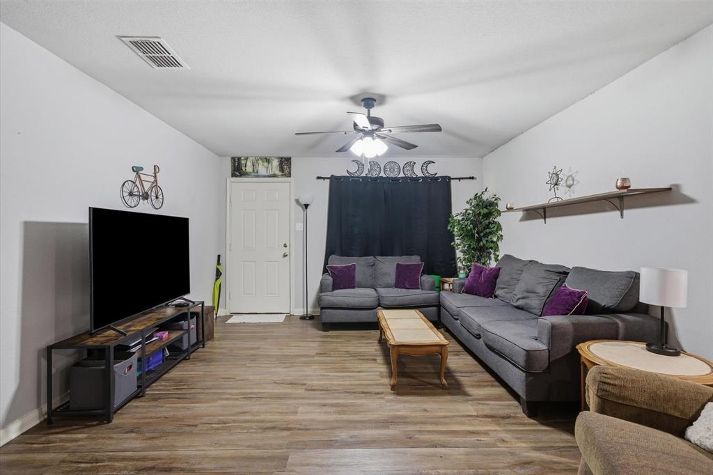 123 Harmon Road Gun Barrel City, TX 75156 - Photo 10 of 36 a living room with furniture and a flat screen tv