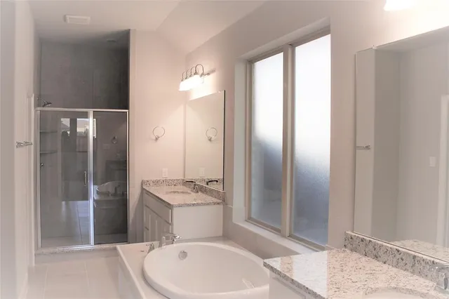 a bathroom with a toilet a sink and shower