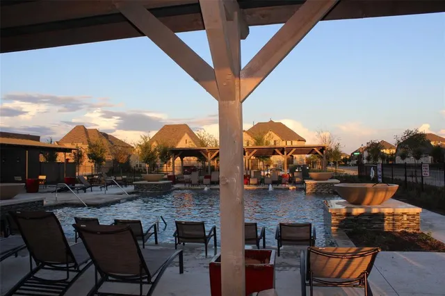 a view of a house with a wooden deck
