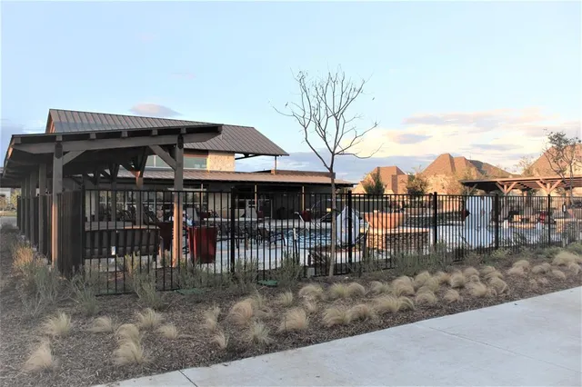 a view of swimming pool and a yard
