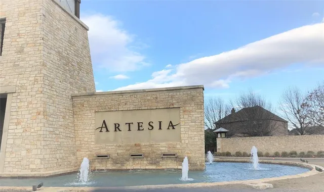 a living room with furniture fireplace and flat screen tv