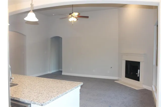 an empty room with a fireplace