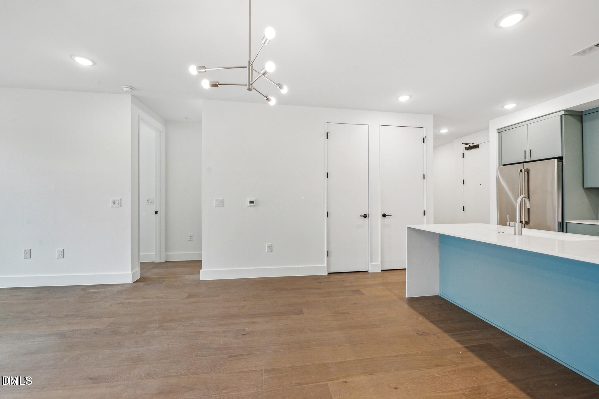 29 Enterprise Street, Unit 109 Raleigh, NC 27607 - Photo 9 of 18 a view of kitchen with white cabinets
