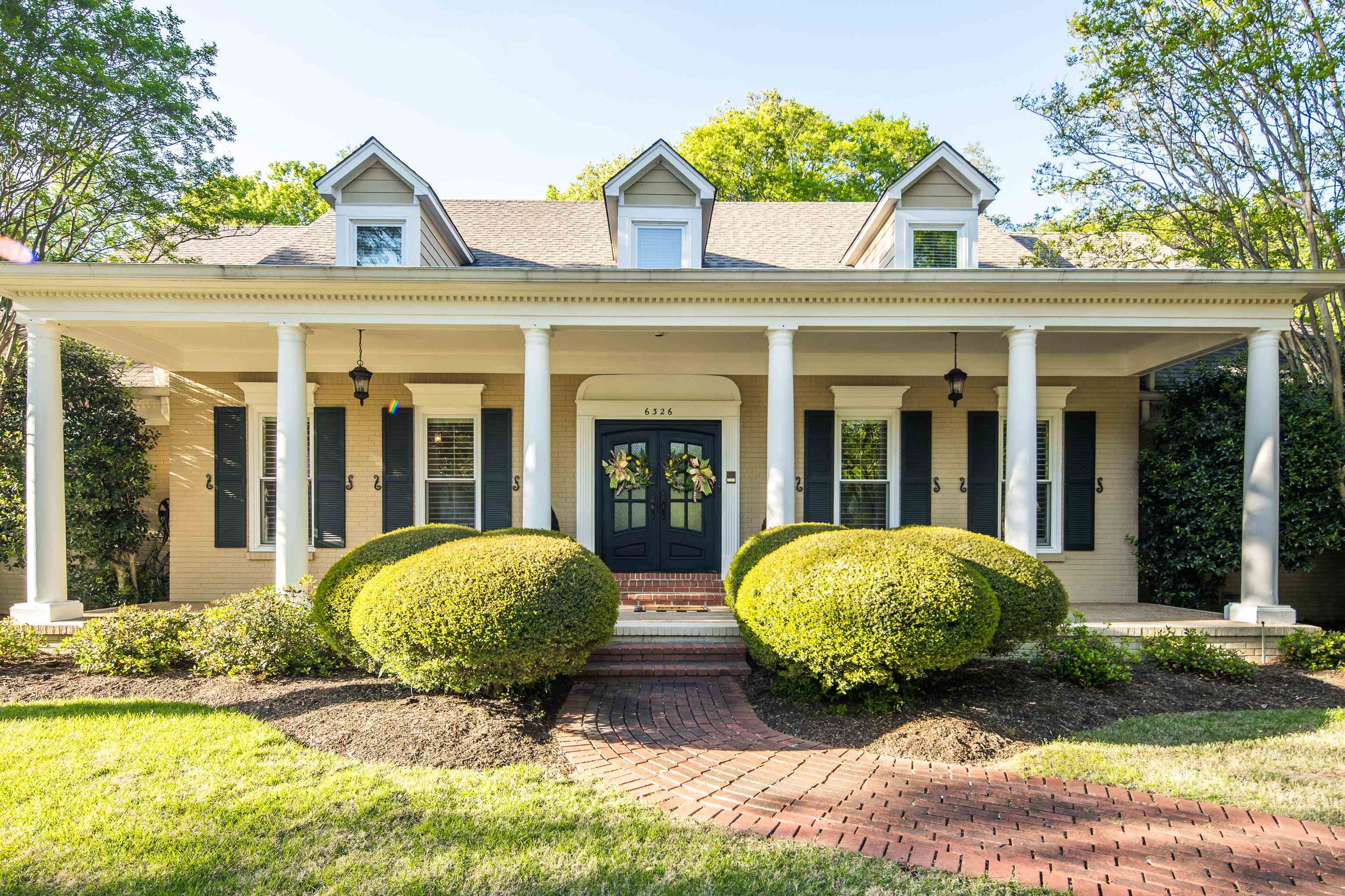 front view of a house with a yard