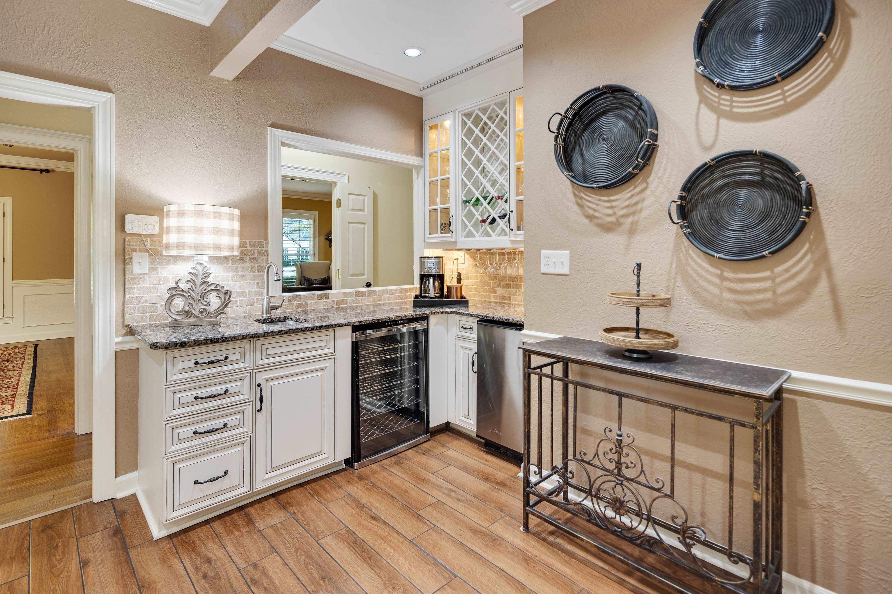 6326 East Shady Grove Road Memphis, TN 38120 - Photo 14 of 40 a kitchen with kitchen island granite countertop a stove and a sink