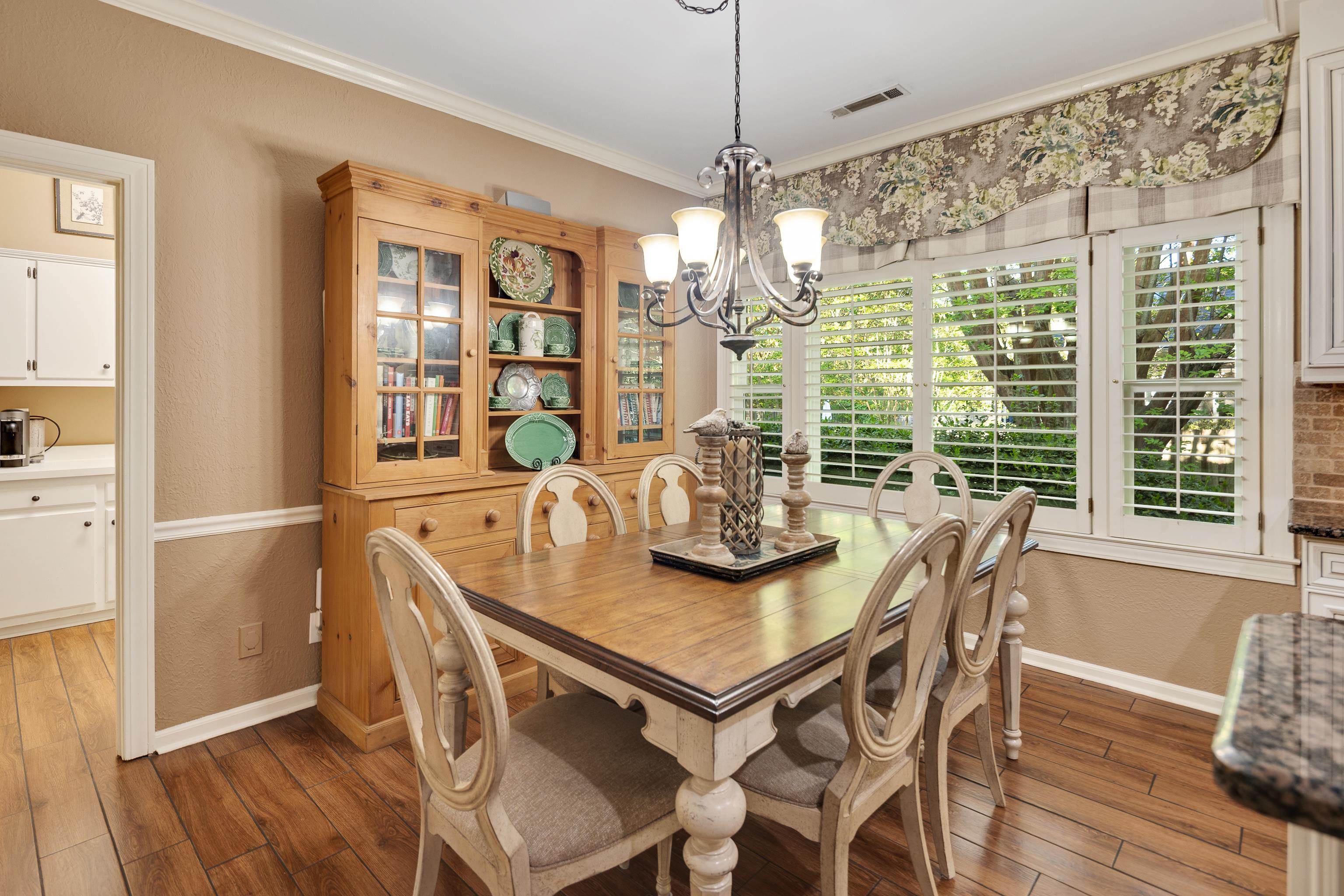 6326 East Shady Grove Road Memphis, TN 38120 - Photo 15 of 40 a view of a dining room with furniture window and wooden floor