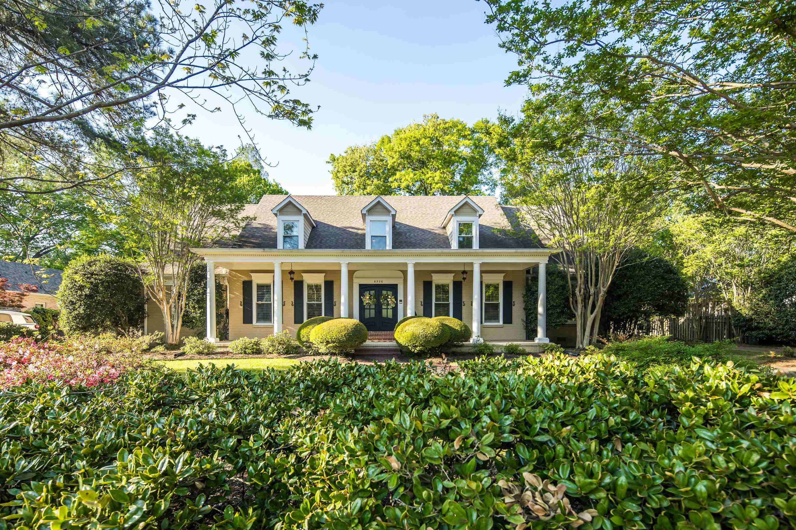6326 East Shady Grove Road Memphis, TN 38120 - Photo 2 of 40 a view of a house with a flower garden