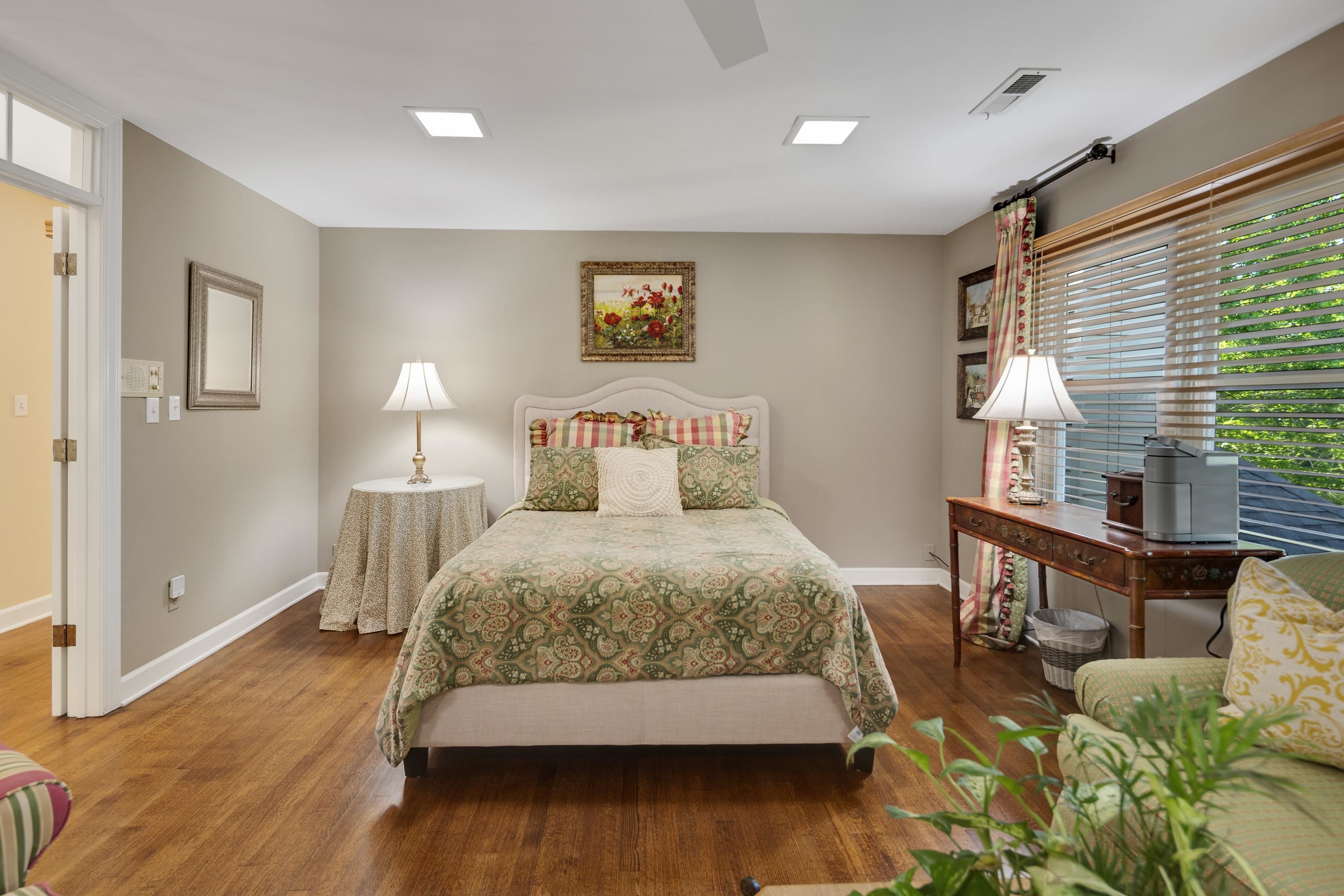 6326 East Shady Grove Road Memphis, TN 38120 - Photo 29 of 40 a bedroom with a bed window and a table