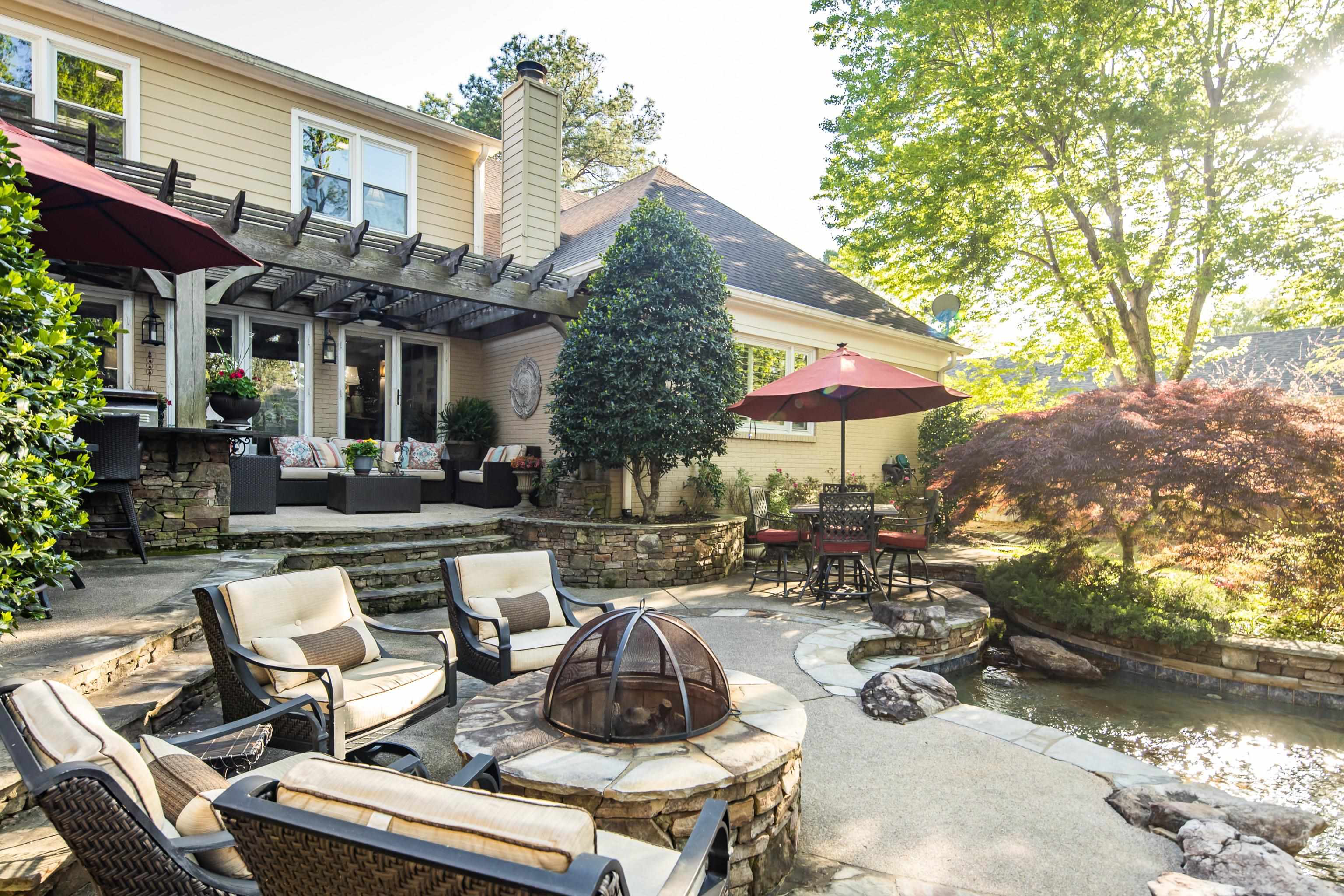 6326 East Shady Grove Road Memphis, TN 38120 - Photo 35 of 40 a view of a patio with couches table and chairs and potted plants