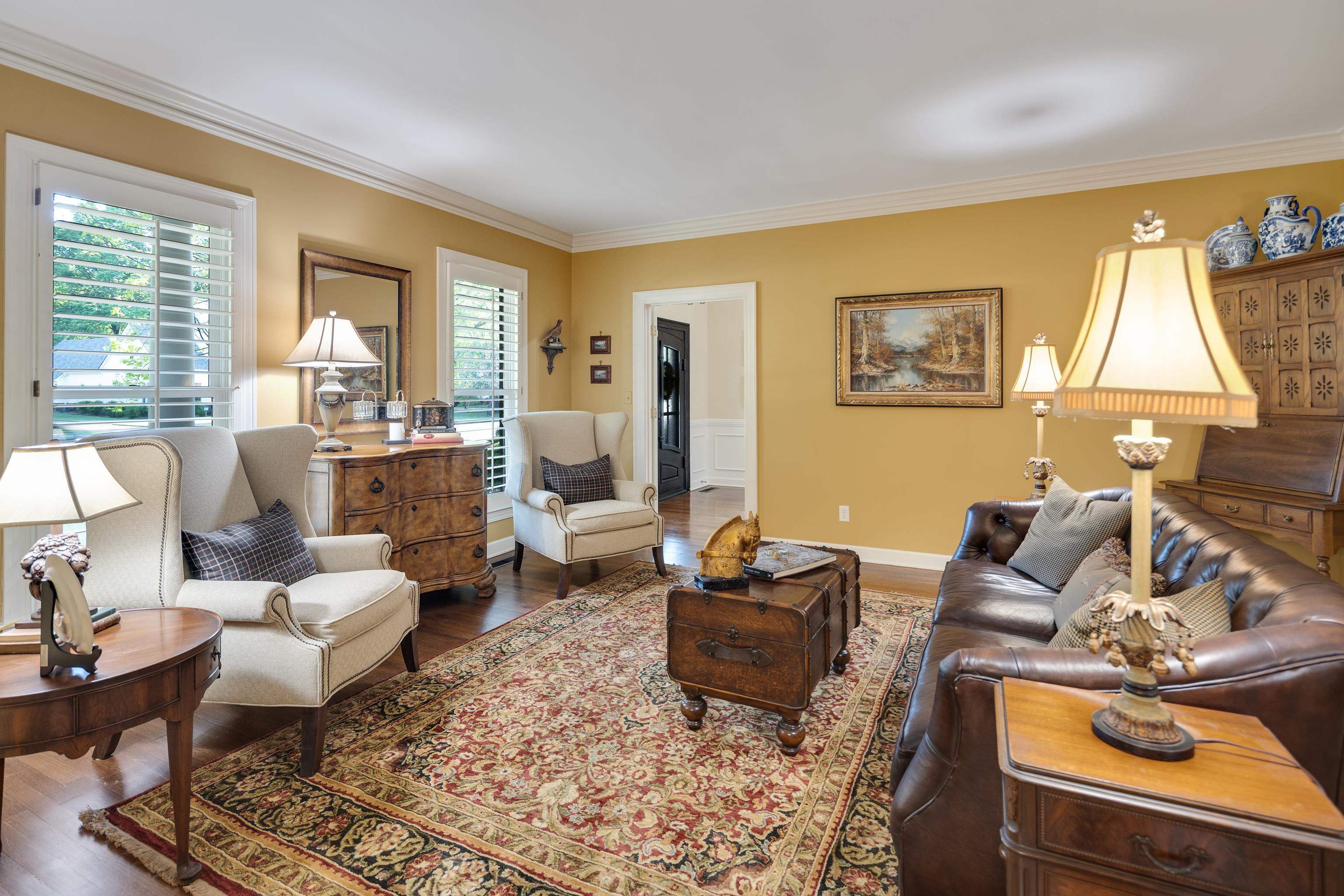 6326 East Shady Grove Road Memphis, TN 38120 - Photo 8 of 40 a living room with furniture and a flat screen tv