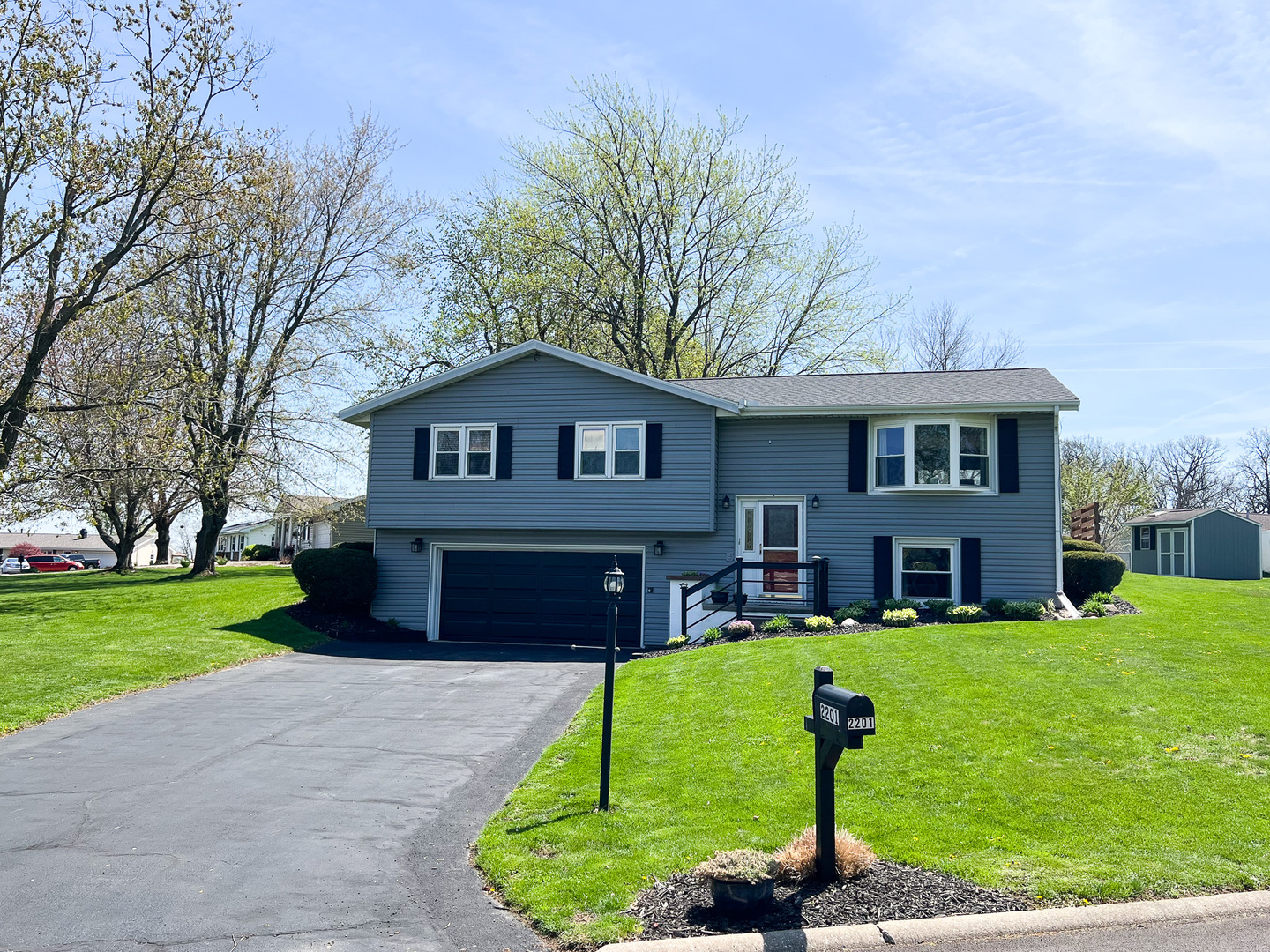 2201 Oak Drive Eureka, IL 61530 - Photo 1 of 25 a front view of a house with garden