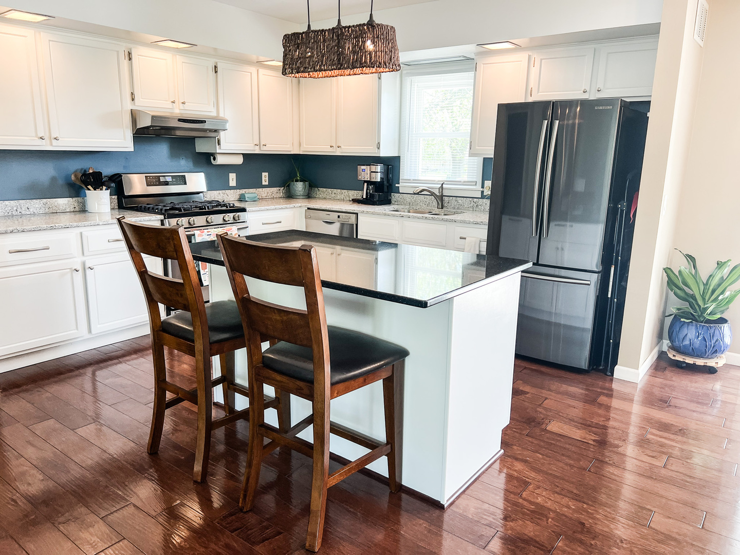 2201 Oak Drive Eureka, IL 61530 - Photo 18 of 25 a kitchen with stainless steel appliances a refrigerator a stove a sink a dining table and chairs