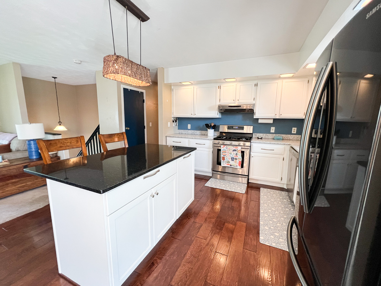 2201 Oak Drive Eureka, IL 61530 - Photo 22 of 25 a kitchen with stainless steel appliances granite countertop a sink stove and refrigerator