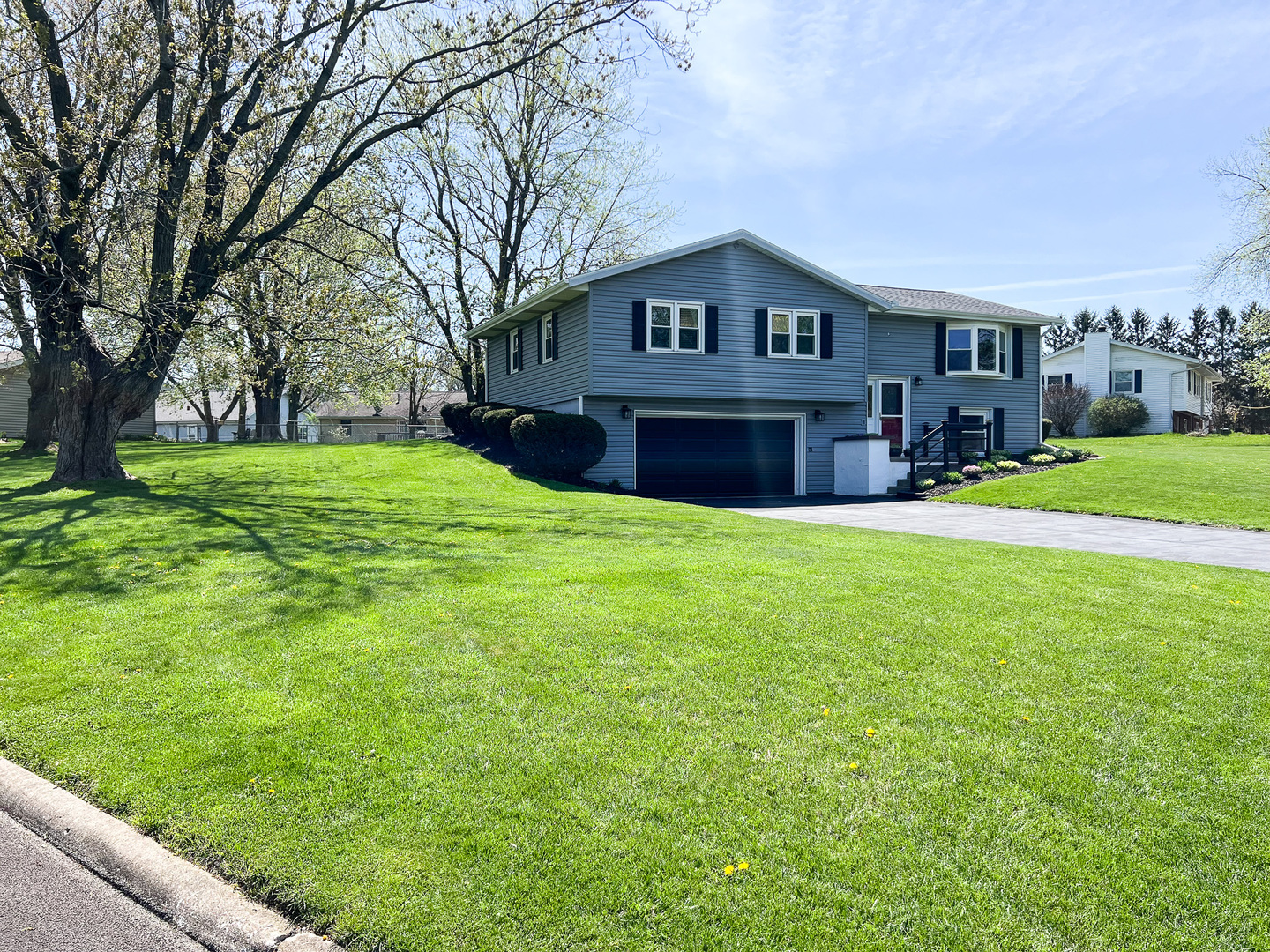 2201 Oak Drive Eureka, IL 61530 - Photo 5 of 25 a view of a house with a big yard with large trees