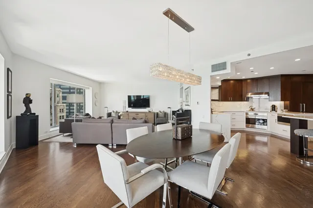 a living room with fireplace furniture and a flat screen tv