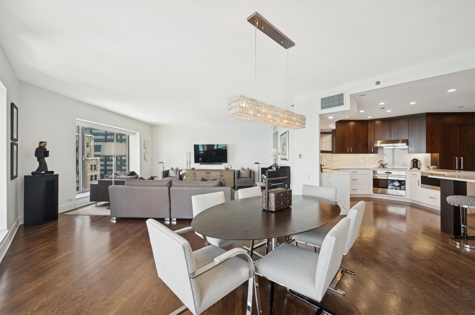 950 North Michigan Avenue, Unit 3705 Chicago, IL 60611 - Photo 12 of 47 a living room with fireplace furniture and a flat screen tv