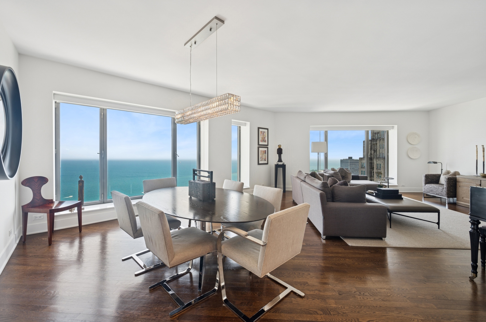 950 North Michigan Avenue, Unit 3705 Chicago, IL 60611 - Photo 13 of 47 a view of a dining room with furniture window and wooden floor