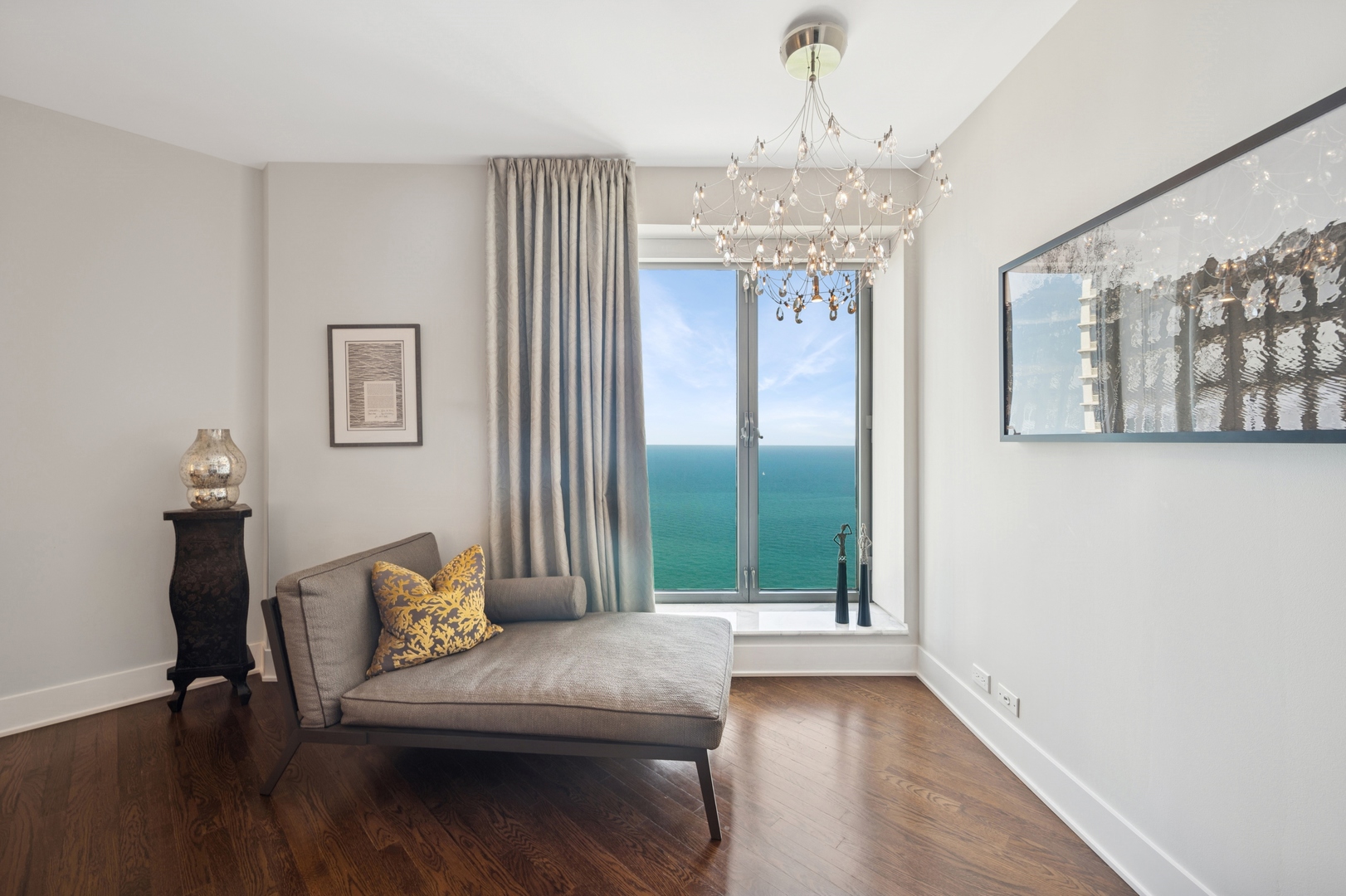 950 North Michigan Avenue, Unit 3705 Chicago, IL 60611 - Photo 19 of 47 a view of a livingroom with furniture and window
