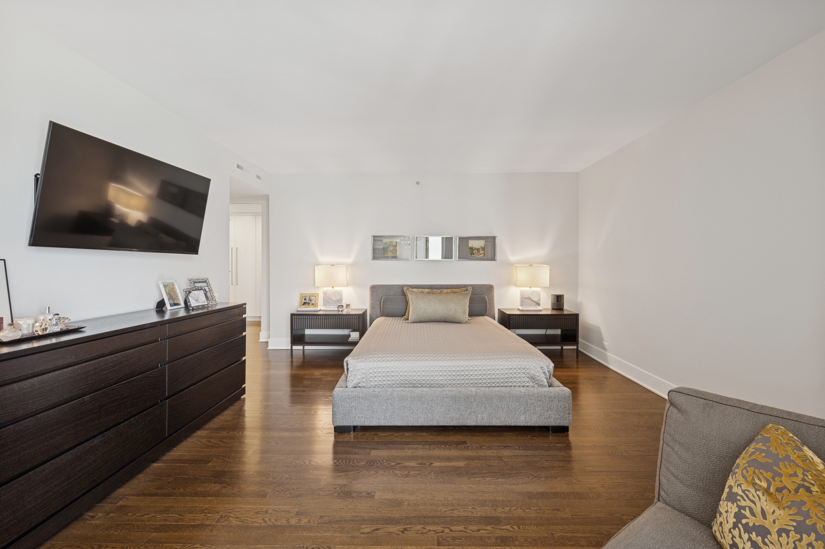 950 North Michigan Avenue, Unit 3705 Chicago, IL 60611 - Photo 20 of 47 a spacious bedroom with a bed and a flat screen tv