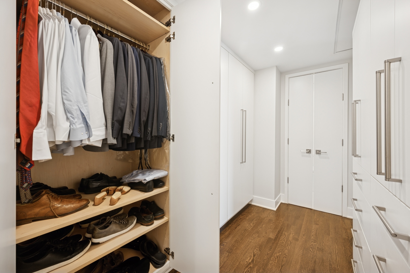 950 North Michigan Avenue, Unit 3705 Chicago, IL 60611 - Photo 26 of 47 a view of walk in closet with clothes and shoes