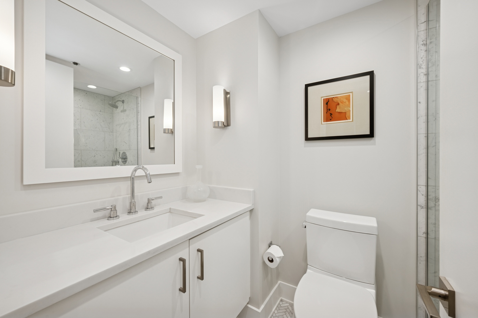 950 North Michigan Avenue, Unit 3705 Chicago, IL 60611 - Photo 29 of 47 a bathroom with a toilet sink and mirror