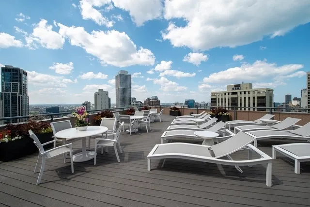 a view of balcony with furniture