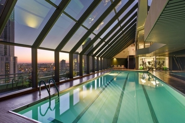 950 North Michigan Avenue, Unit 3705 Chicago, IL 60611 - Photo 42 of 47 a view of a swimming pool with a patio