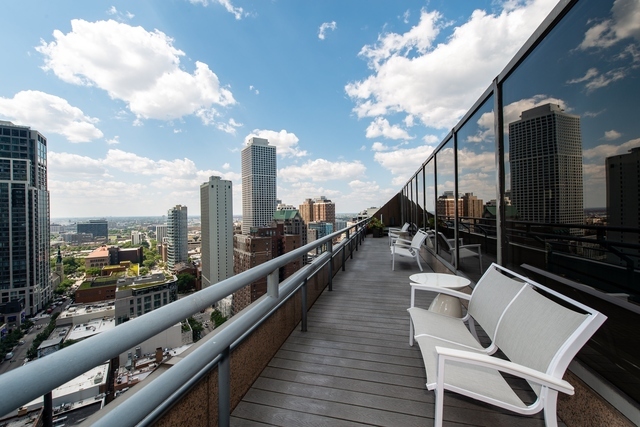 950 North Michigan Avenue, Unit 3705 Chicago, IL 60611 - Photo 43 of 47 a view of balcony with furniture