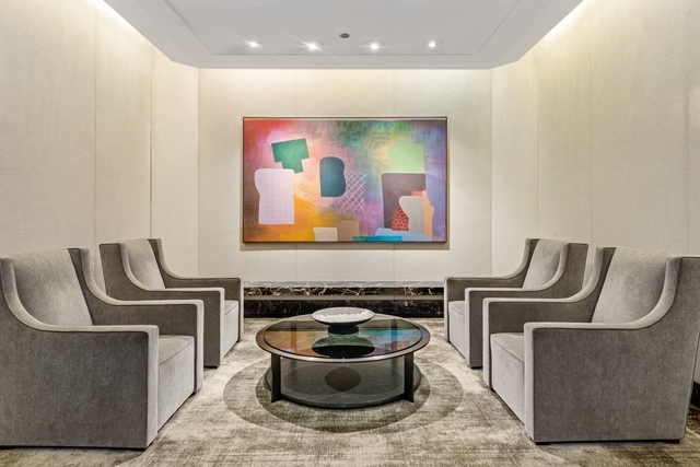 950 North Michigan Avenue, Unit 3705 Chicago, IL 60611 - Photo 46 of 47 a living room with furniture a piano and a flat screen tv