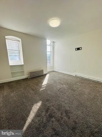 a view of a bedroom with a balcony